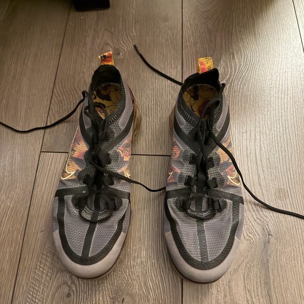 Nike Black and Gray Athletic Shoes with Orange Accents